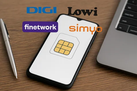 Logotipos de OMV como DIGI, Lowi, Finetwork y simyo flotando sobre un smartphone en una mesa de madera.